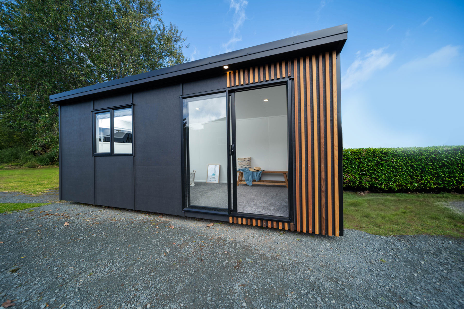 Original Hut – Black Joinery and Cedar feature